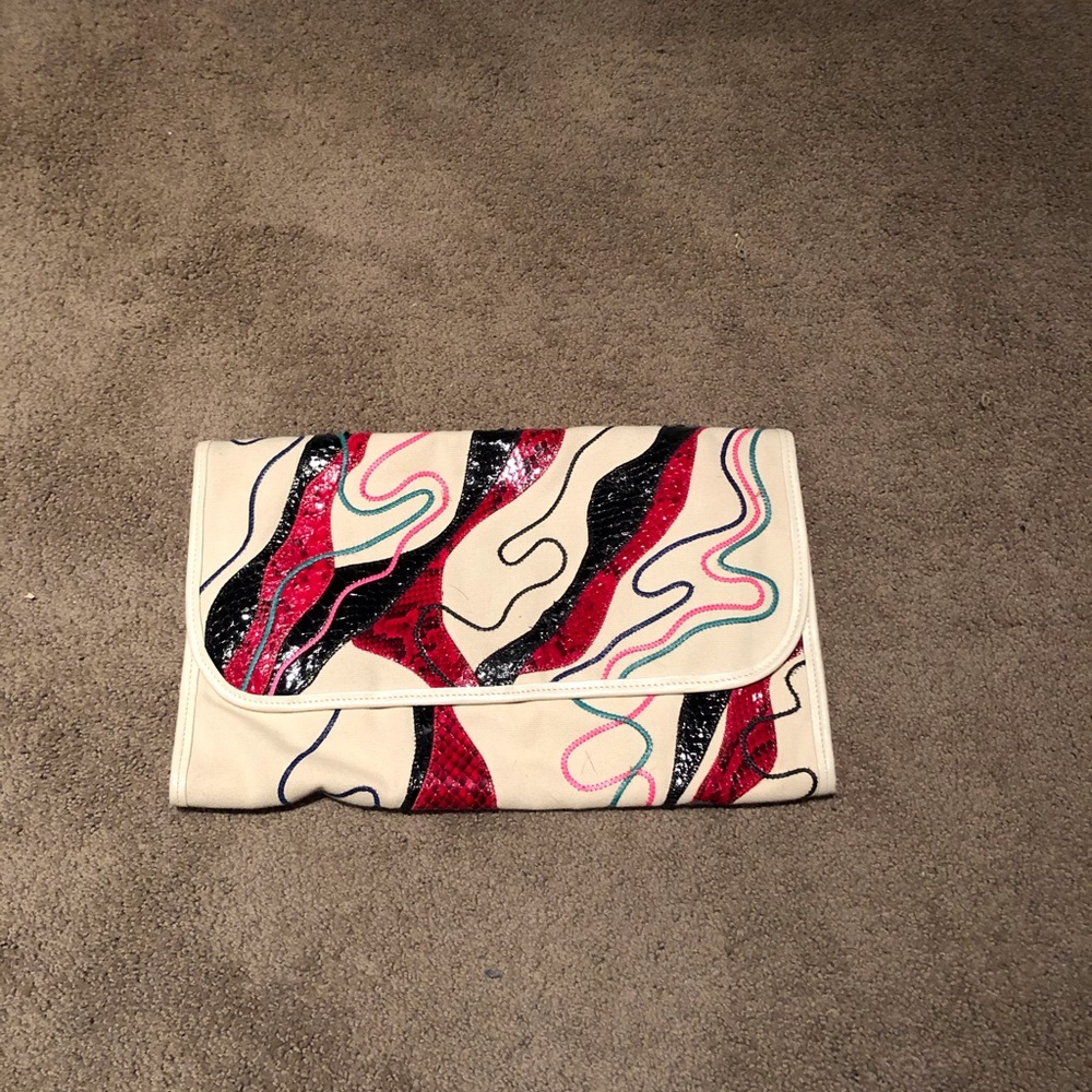 Vintage Carlos Falchi snake and canvas clutch.